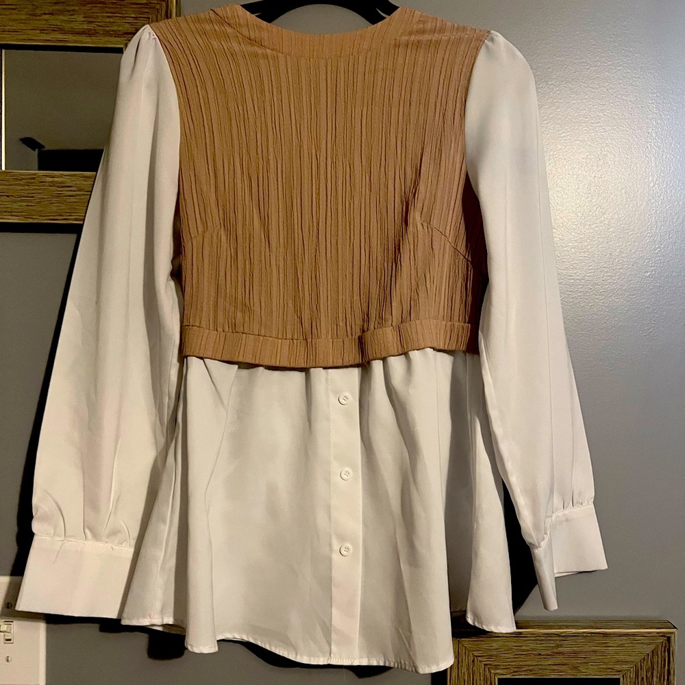 New, without tags. Brown vest white blouse, button closure. All one piece.